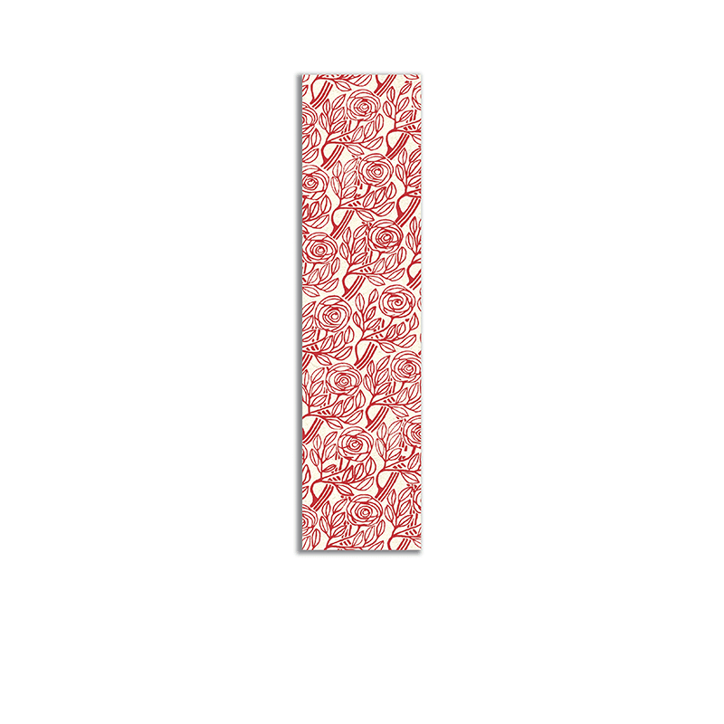Punto de libro, en plástico, inspirado en las fachadas modernistas de Barcelona. Modelo floral en rojo y blanco.