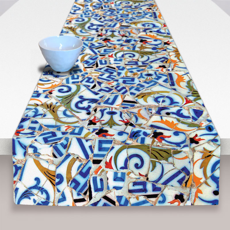 Table runner in blue with yellow and red details on a white background