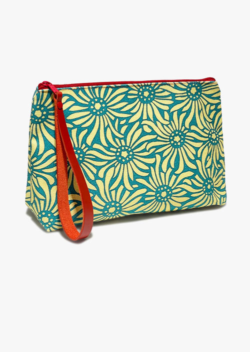 Vanity case in cotton fabric with turquoise and yellow design, red zipper and handle
