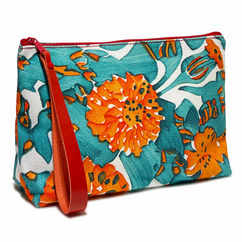 Toiletry bag in blue and orange tones, red zipper and handle