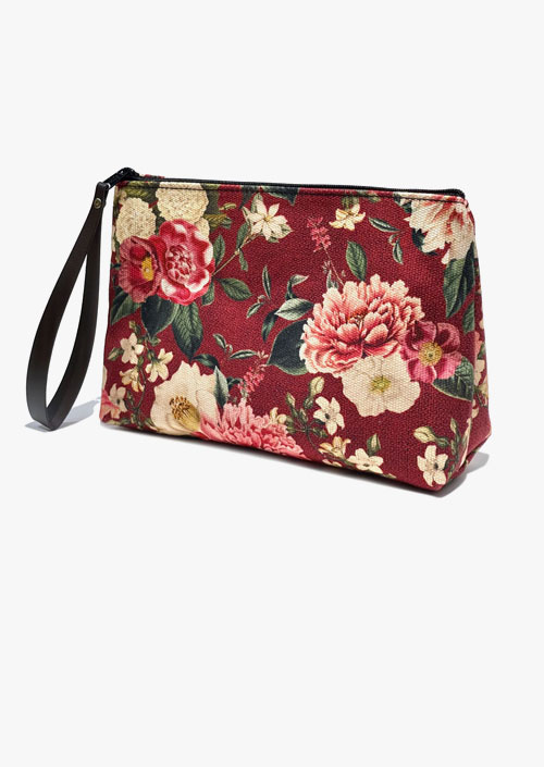 Vanity case with floral design on a garnet background